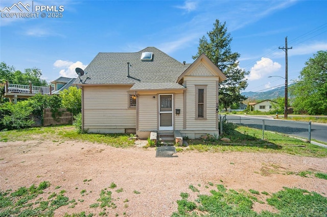 117 S Limit St, Colorado Springs, CO 80905 - view of front of house with a fenced backyard, entry steps, and roof with shingles
