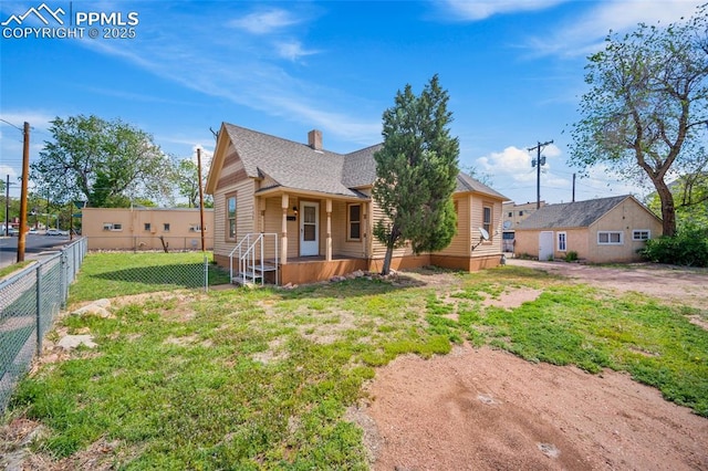 117 S Limit St, Colorado Springs, CO 80905 - view of front of home with a chimney and roof with shingles