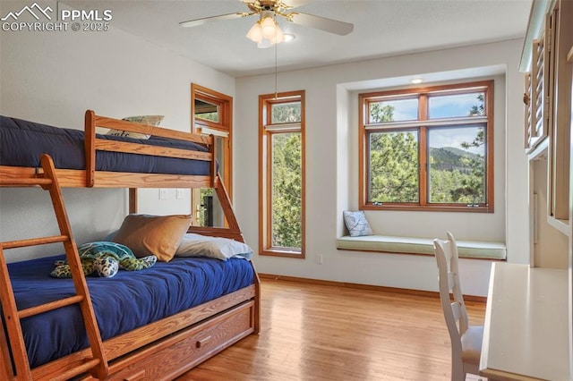215 Morning Sun Dr, Woodland Park, CO 80863 - bedroom featuring light wood-style floors and baseboards