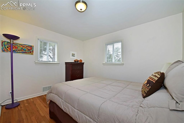 418 N Baldwin St, Woodland Park, CO 80863 - bedroom with wood finished floors and baseboards