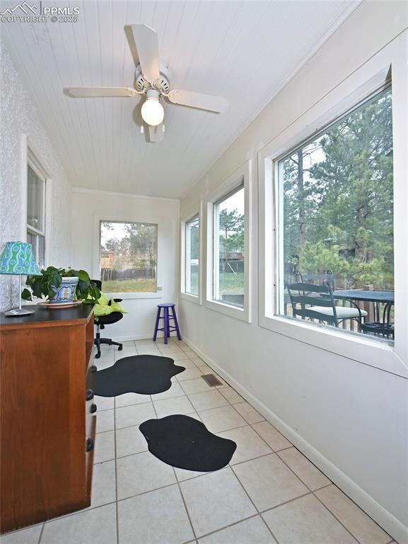 418 N Baldwin St, Woodland Park, CO 80863 - sunroom / solarium with tile patterned flooring and baseboards