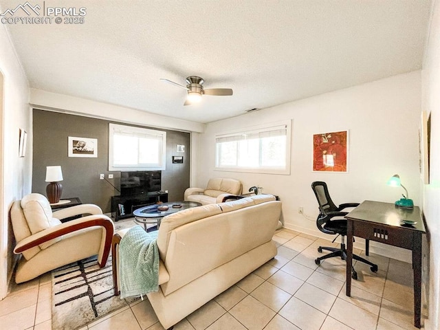 418 N Baldwin St, Woodland Park, CO 80863 - living room featuring a ceiling fan and light tile patterned floors