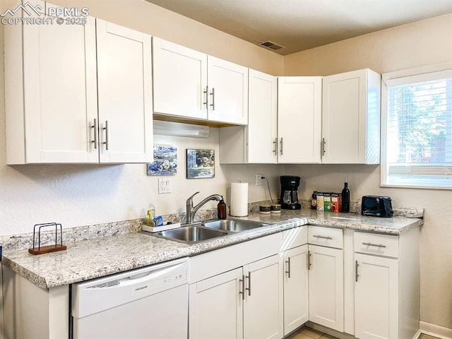 418 N Baldwin St, Woodland Park, CO 80863 - kitchen featuring white dishwasher, a sink, light countertops, and white cabinets