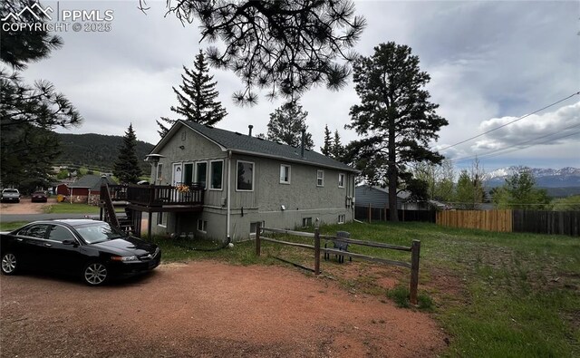 418 N Baldwin St, Woodland Park, CO 80863 - view of front of home with a deck with mountain view