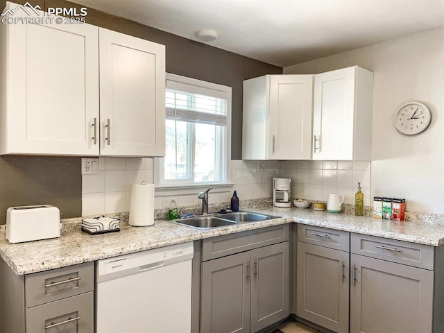 418 N Baldwin St, Woodland Park, CO 80863 - kitchen featuring white dishwasher, a sink, gray cabinets, tasteful backsplash, and white cabinets