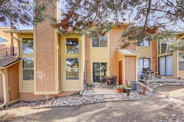4120 Autumn Heights Dr Unit B, Colorado Springs, CO 80906 - back of house featuring stucco siding and a patio area
