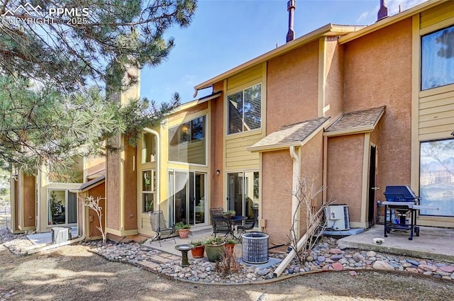 4120 Autumn Heights Dr Unit B, Colorado Springs, CO 80906 - rear view of property with stucco siding and a patio
