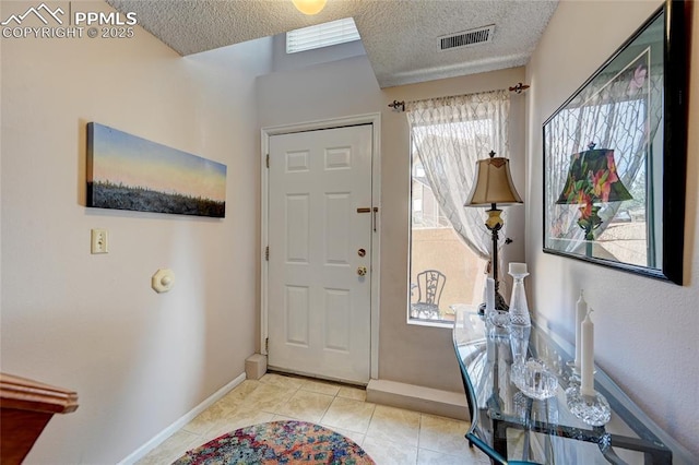 4120 Autumn Heights Dr Unit B, Colorado Springs, CO 80906 - foyer entrance with a textured ceiling and light tile patterned floors