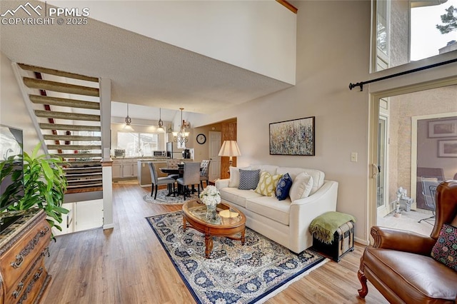 4120 Autumn Heights Dr Unit B, Colorado Springs, CO 80906 - living area featuring light wood-type flooring and a chandelier
