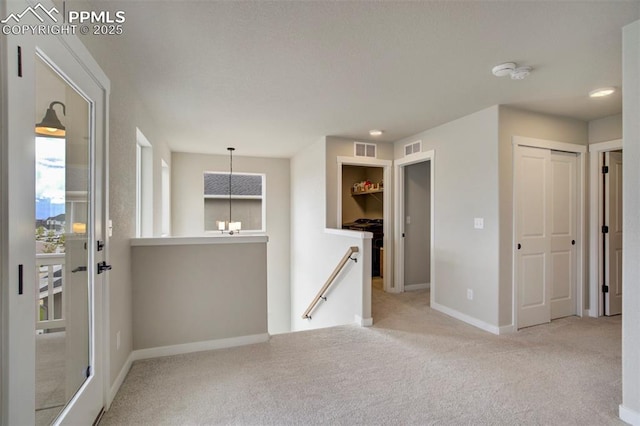 6471 Rolling Creek Dr, Colorado Springs, CO 80924 - spare room featuring carpet flooring, baseboards, and a chandelier