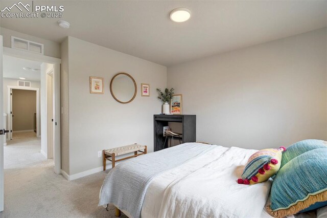 6471 Rolling Creek Dr, Colorado Springs, CO 80924 - bedroom featuring light carpet and baseboards