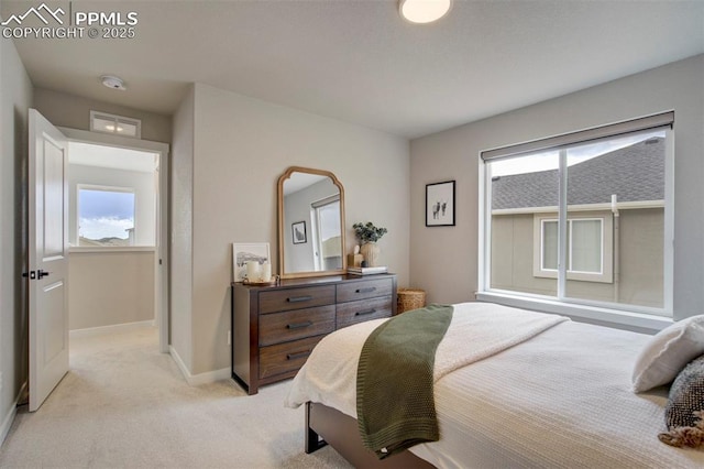 6471 Rolling Creek Dr, Colorado Springs, CO 80924 - bedroom featuring multiple windows, light colored carpet, and baseboards