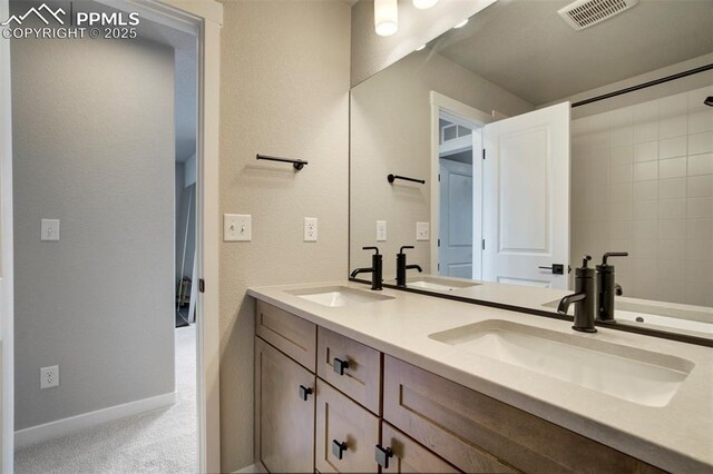 6471 Rolling Creek Dr, Colorado Springs, CO 80924 - bathroom with double vanity and baseboards
