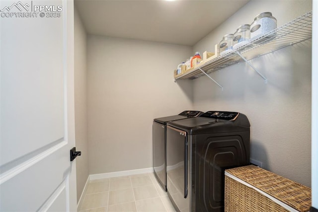 6471 Rolling Creek Dr, Colorado Springs, CO 80924 - laundry area featuring washer and clothes dryer, baseboards, and light tile patterned flooring