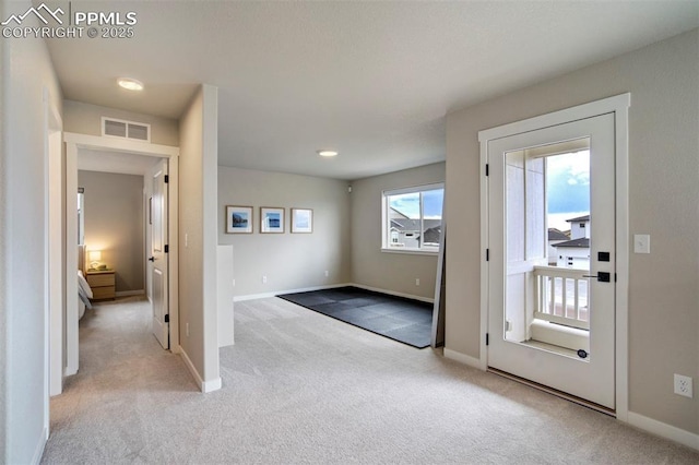 6471 Rolling Creek Dr, Colorado Springs, CO 80924 - entryway with light colored carpet and baseboards