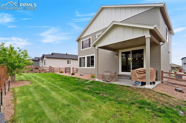 6471 Rolling Creek Dr, Colorado Springs, CO 80924 - back of house featuring board and batten siding and a patio area