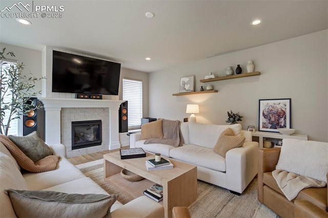 6471 Rolling Creek Dr, Colorado Springs, CO 80924 - living room with recessed lighting, a tile fireplace, and light wood finished floors