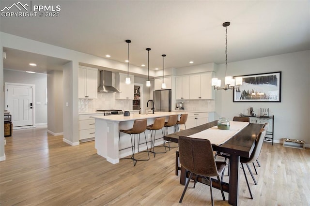 6471 Rolling Creek Dr, Colorado Springs, CO 80924 - dining space featuring a chandelier, baseboards, light wood-type flooring, and recessed lighting