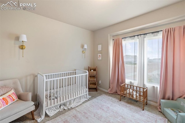 6374 Tramore Way, Colorado Springs, CO 80923 - bedroom with carpet floors and a crib