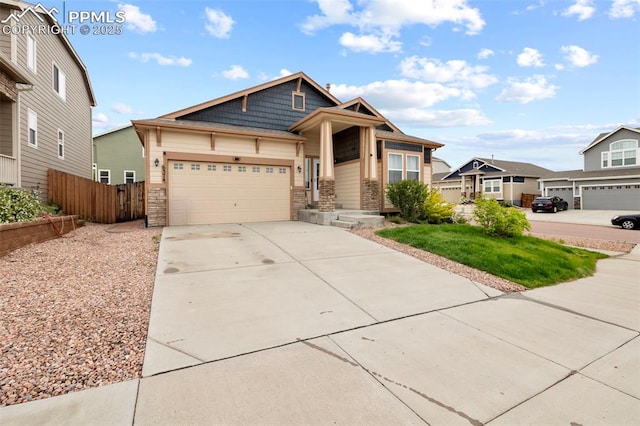6374 Tramore Way, Colorado Springs, CO 80923 - craftsman-style house with stone siding, driveway, an attached garage, and a residential view