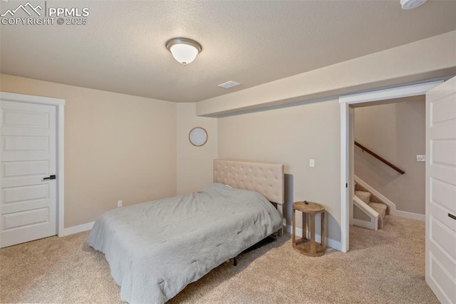 6374 Tramore Way, Colorado Springs, CO 80923 - carpeted bedroom with a textured ceiling and baseboards