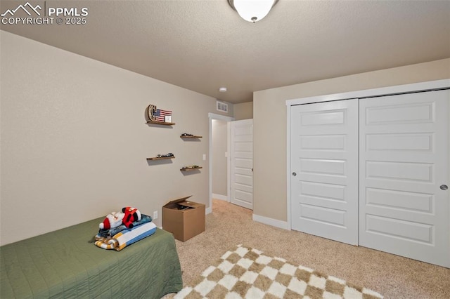 6374 Tramore Way, Colorado Springs, CO 80923 - bedroom with carpet, a textured ceiling, and a closet