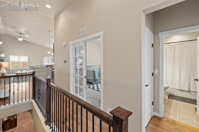 6374 Tramore Way, Colorado Springs, CO 80923 - hallway featuring vaulted ceiling and baseboards