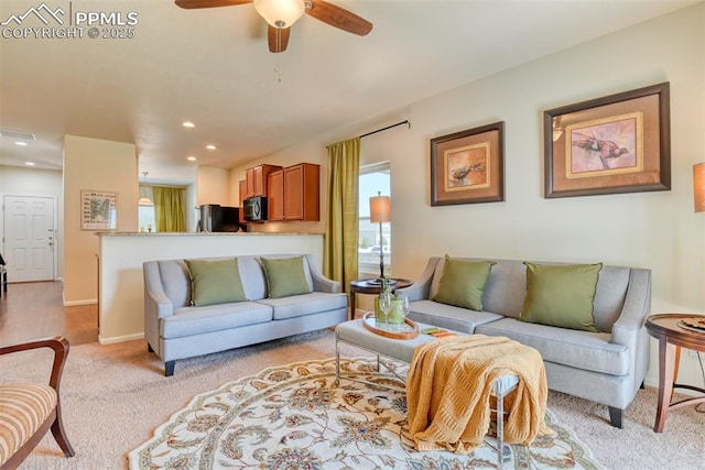 6676 Liberator Trl, Colorado Springs, CO 80925 - living area featuring light colored carpet, ceiling fan, recessed lighting, and baseboards