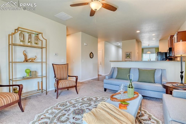 6676 Liberator Trl, Colorado Springs, CO 80925 - living area featuring ceiling fan, light colored carpet, baseboards, and recessed lighting