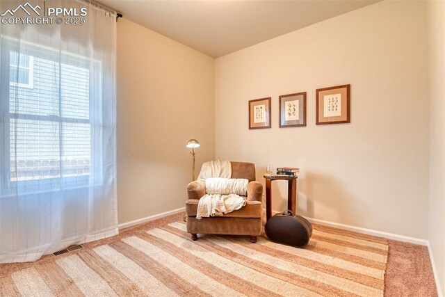 6676 Liberator Trl, Colorado Springs, CO 80925 - sitting room featuring carpet and baseboards