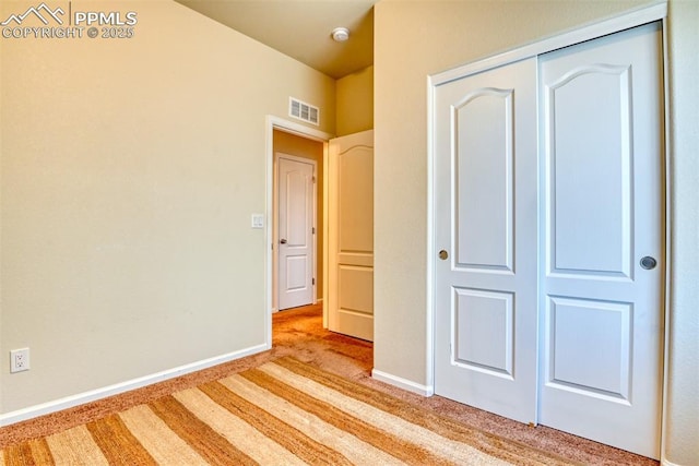6676 Liberator Trl, Colorado Springs, CO 80925 - unfurnished bedroom with carpet, a closet, and baseboards