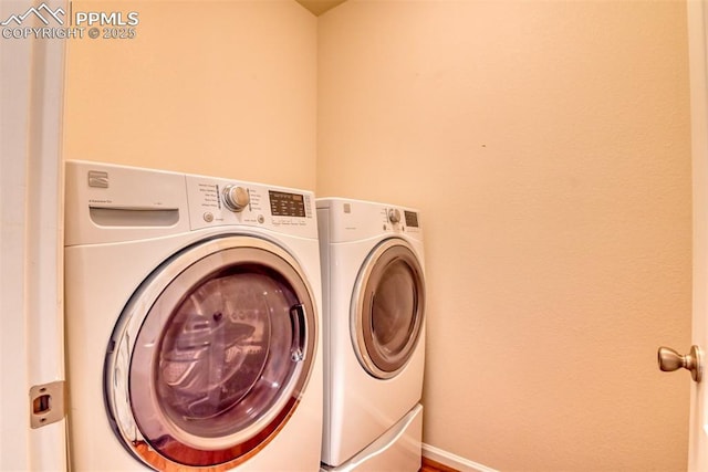 6676 Liberator Trl, Colorado Springs, CO 80925 - washroom with washer and dryer and baseboards