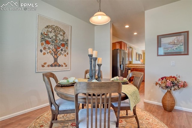 6676 Liberator Trl, Colorado Springs, CO 80925 - dining area with light wood-style floors, baseboards, and recessed lighting
