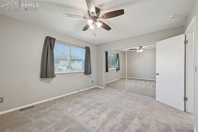 2013 Erin Loop, Colorado Springs, CO 80918 - unfurnished bedroom with carpet, a textured ceiling, a closet, ceiling fan, and baseboards