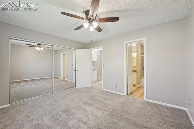 2013 Erin Loop, Colorado Springs, CO 80918 - unfurnished bedroom with light carpet, baseboards, a closet, a textured ceiling, and ensuite bath