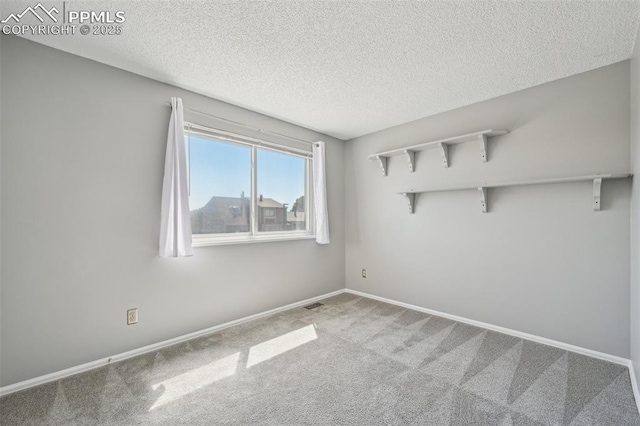 2013 Erin Loop, Colorado Springs, CO 80918 - carpeted spare room featuring a textured ceiling and baseboards