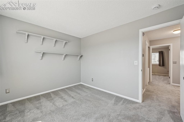 2013 Erin Loop, Colorado Springs, CO 80918 - unfurnished room with carpet floors, a smoke detector, a textured ceiling, and baseboards