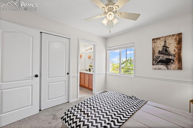 8370 Lupan Dr, Colorado Springs, CO 80951 - bedroom featuring light colored carpet, a closet, connected bathroom, and a ceiling fan