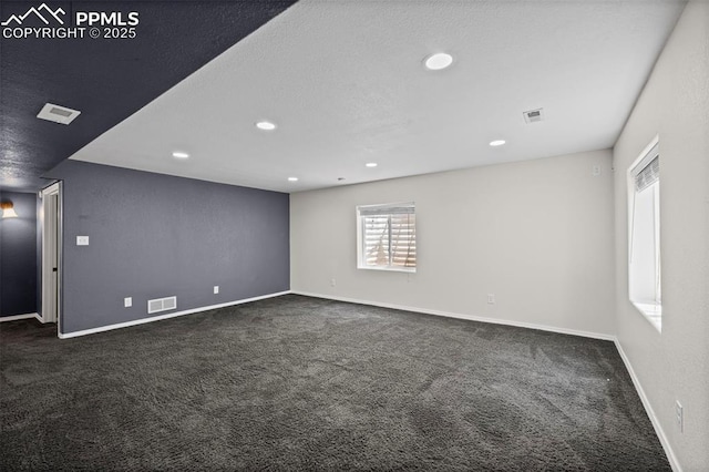 8370 Lupan Dr, Colorado Springs, CO 80951 - unfurnished room featuring dark carpet and recessed lighting