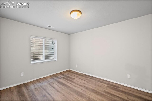 8370 Lupan Dr, Colorado Springs, CO 80951 - spare room featuring wood finished floors and baseboards