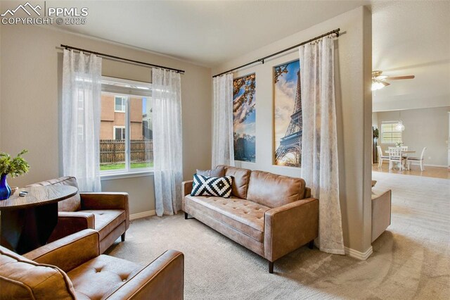 6874 Quiet Pond Pl, Colorado Springs, CO 80923 - carpeted living room with baseboards and a ceiling fan