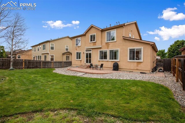 6874 Quiet Pond Pl, Colorado Springs, CO 80923 - rear view of property with stucco siding, a patio, and entry steps