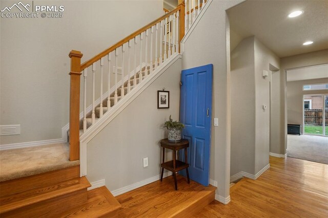 6874 Quiet Pond Pl, Colorado Springs, CO 80923 - stairs with recessed lighting, baseboards, and wood finished floors