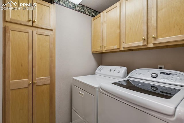 14115 Nichlas Ct, Colorado Springs, CO 80921 - washroom featuring cabinet space and washer and clothes dryer
