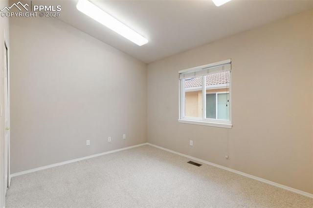 14115 Nichlas Ct, Colorado Springs, CO 80921 - empty room with carpet, lofted ceiling, and baseboards