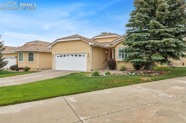 14115 Nichlas Ct, Colorado Springs, CO 80921 - mediterranean / spanish-style house featuring a garage, a tiled roof, driveway, and stucco siding