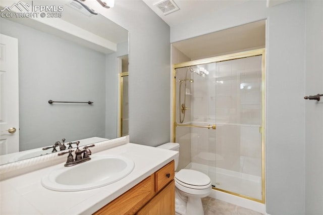 14115 Nichlas Ct, Colorado Springs, CO 80921 - bathroom with toilet, a shower stall, vanity, and tile patterned floors
