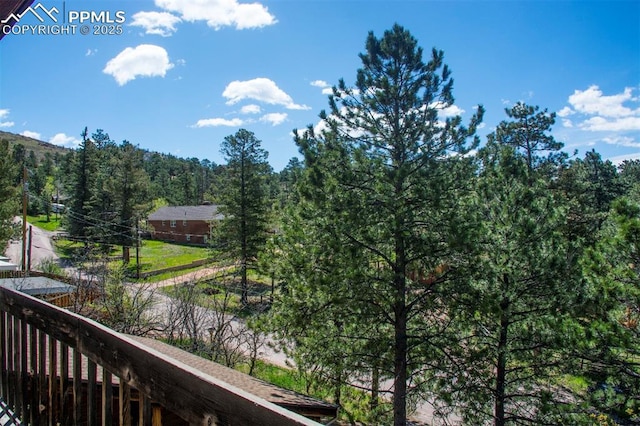 7770 N Topeka Ave, Cascade, CO 80809 - balcony featuring a forest view