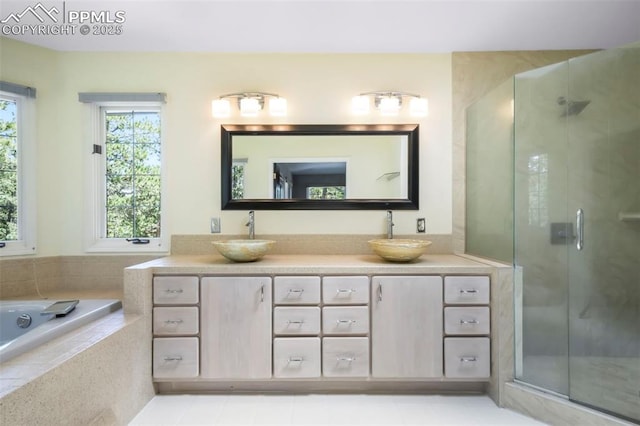 1240 Lone Scout Lookout, Monument, CO 80132 - full bath featuring double vanity, a stall shower, and a bath