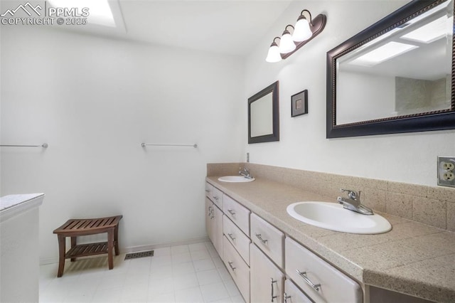 1240 Lone Scout Lookout, Monument, CO 80132 - bathroom featuring double vanity and baseboards